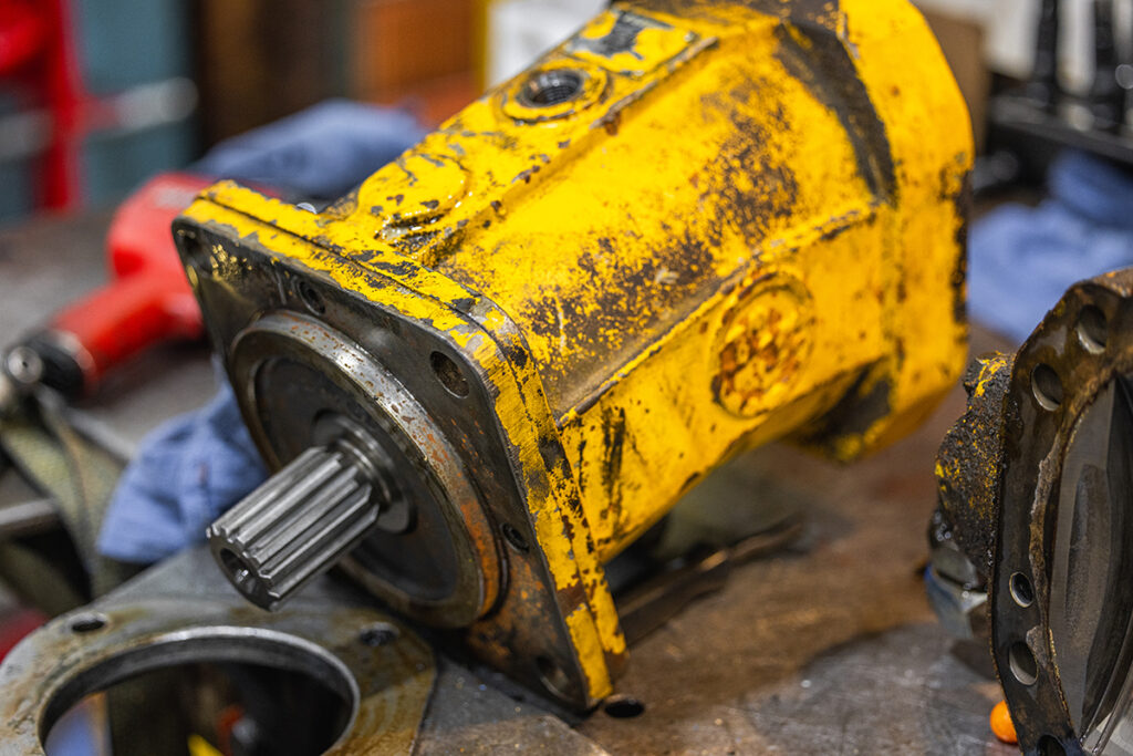 A motor with chipped paint and some corrosion